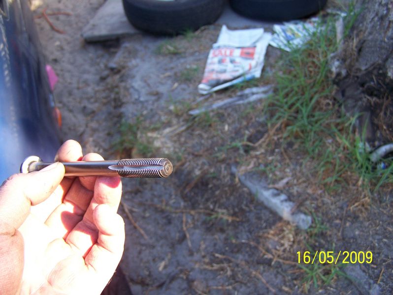 Modified head bolt for cleaning up threads.